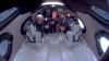Passengers of Galactic 2 in the cabin of VSS Unity